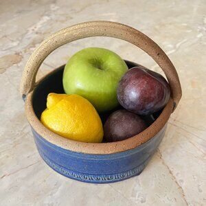Handmade blue ceramic serving dish with handle